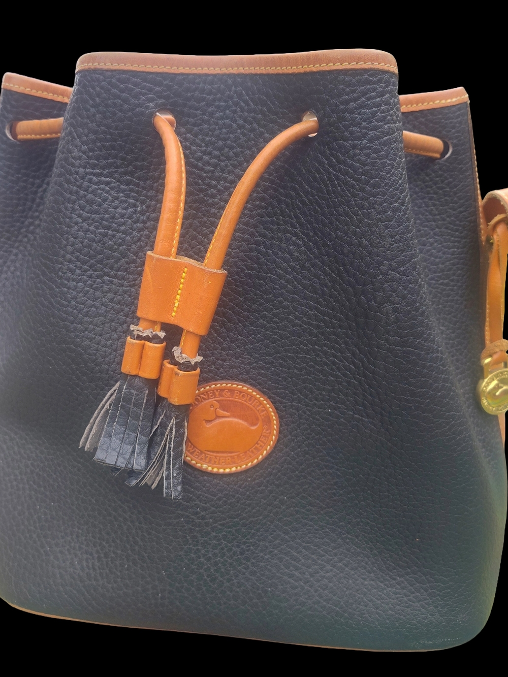 Dooney & Bourke Black Pebbled Leather Bucket Bag with Tan Trim